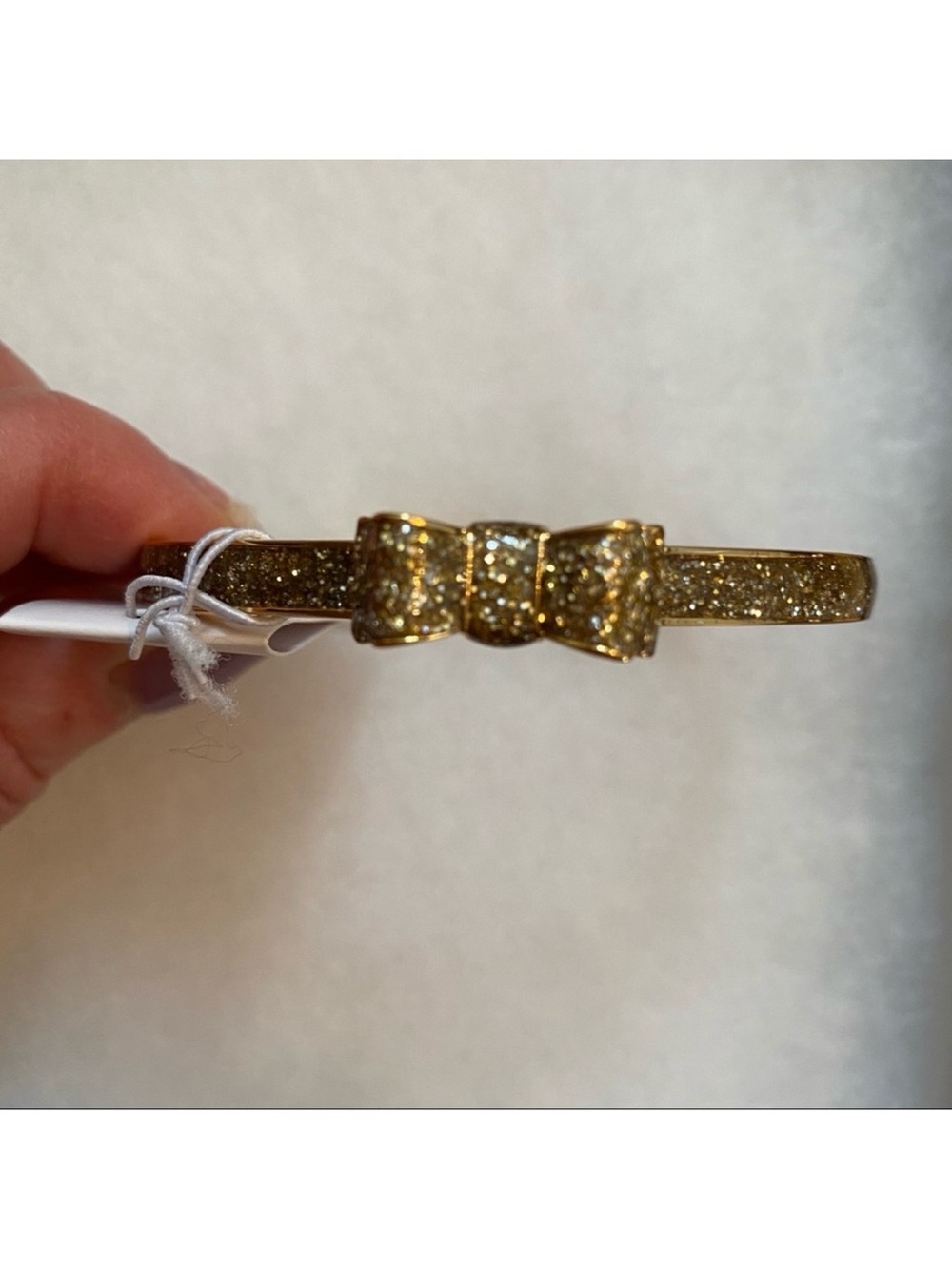 KATE SPADE NEW NWT BRACELET BANGLE GOLD PLATE GLITTER BOW MOON RIVER JEWELRY - Picture 1 of 8